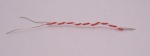 The wires swirled apart both ends. Notice that on the right side (where the match's head would be) the wires are parallel to each other
